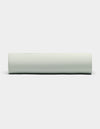 A Bamboo Fitted Sheet by Cozy Earth is displayed against a plain white background, viewed from the side. |Color:Laurel