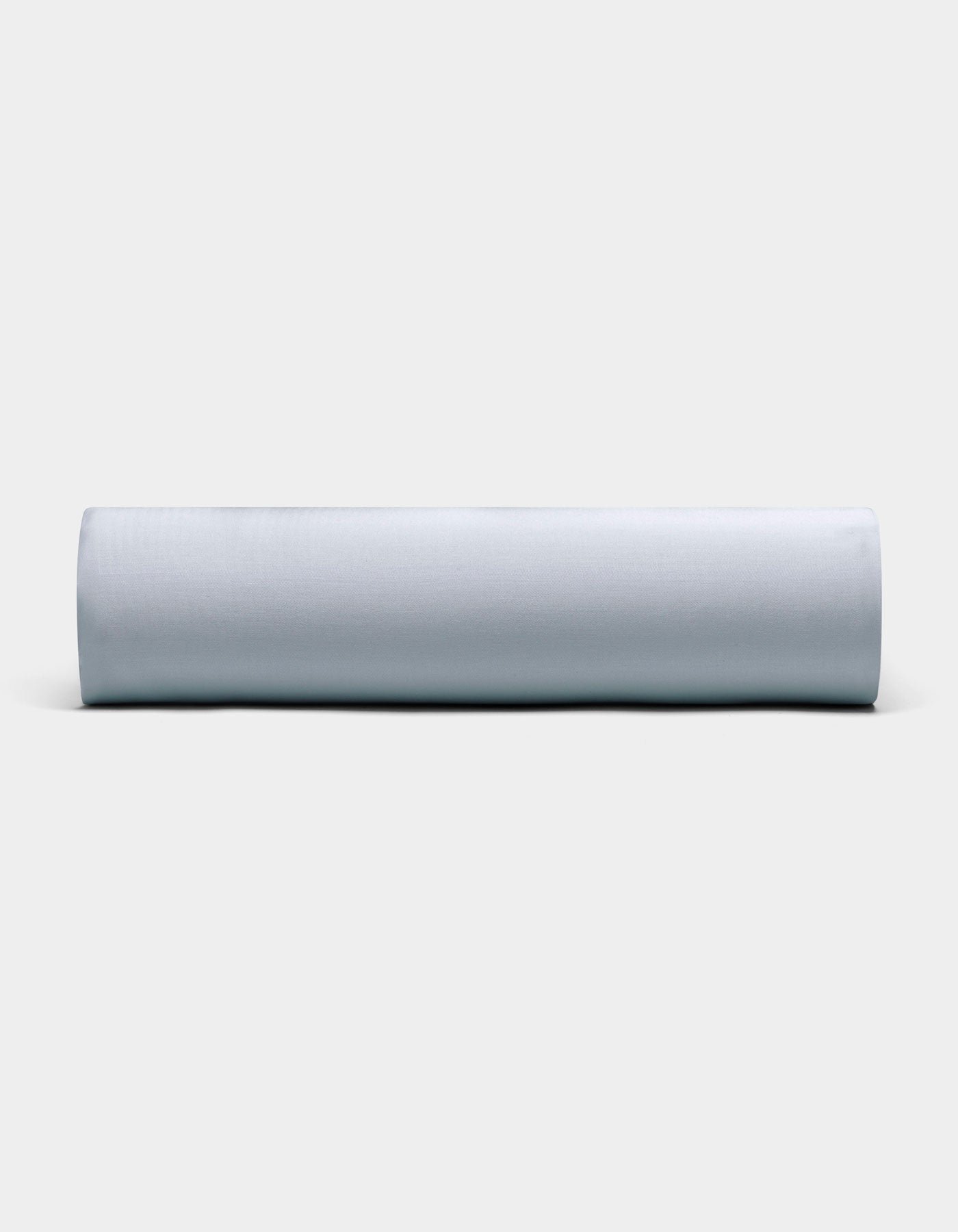A Bamboo Fitted Sheet by Cozy Earth, neatly rolled and displayed horizontally, is showcased against a plain, light background with its soft light gray fabric visible from the front.