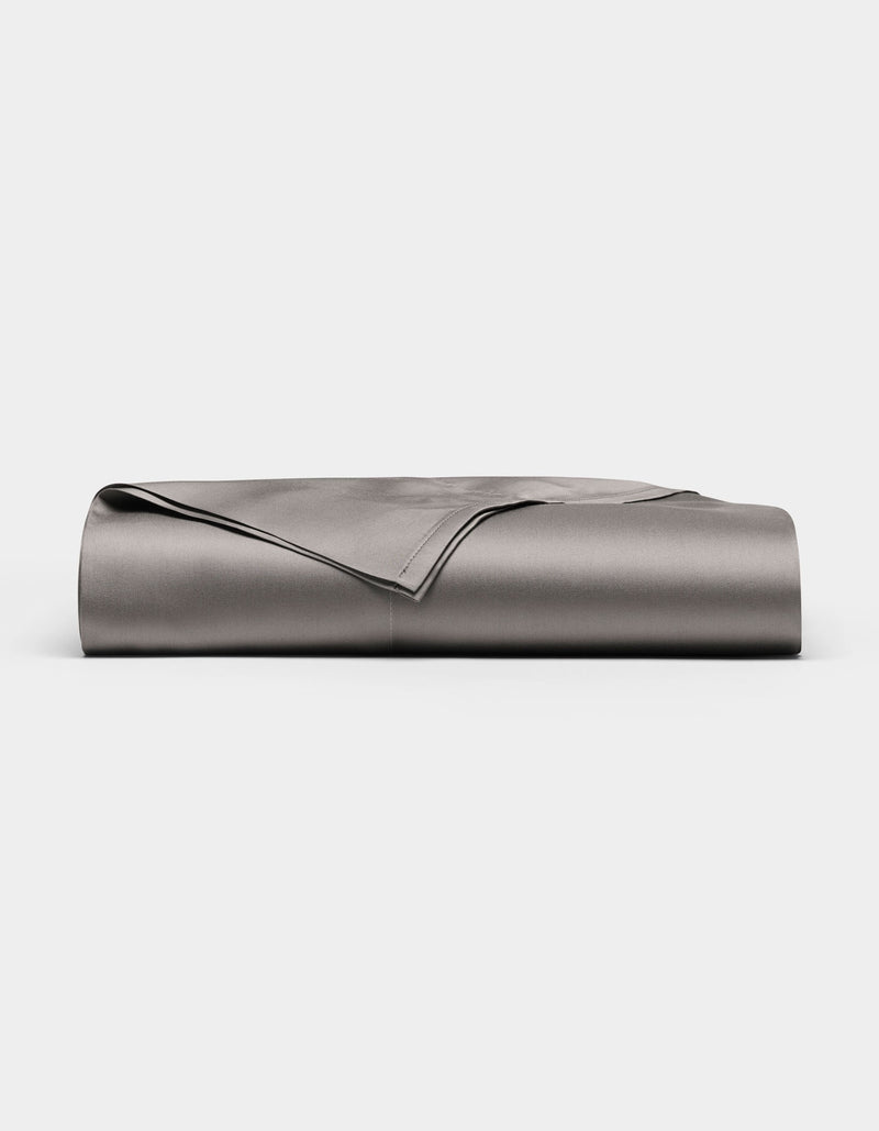 A neatly folded, smooth Cozy Earth Bamboo Flat Sheet in grey is displayed against a plain white background.