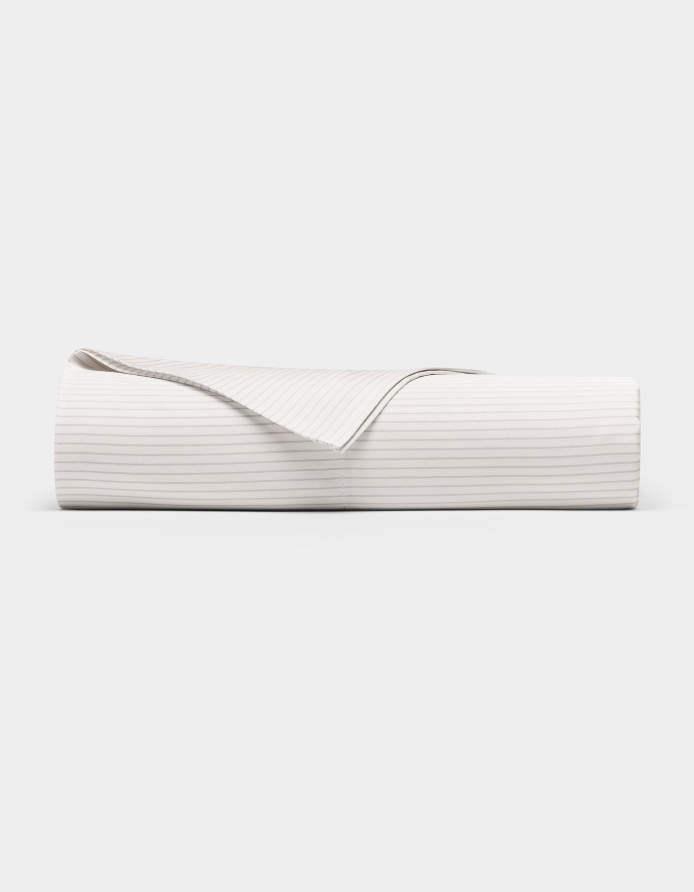 The Cozy Earth Bamboo Flat Sheet, shown neatly folded with one corner turned over to reveal the underside, features subtle horizontal stripes and is displayed against a plain white background.|Color:Driftwood Pinstripe