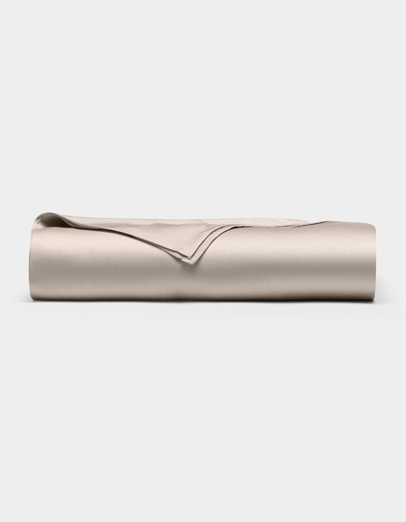 The Cozy Earth Bamboo Flat Sheet, neatly folded in light beige, is displayed on a plain white background.