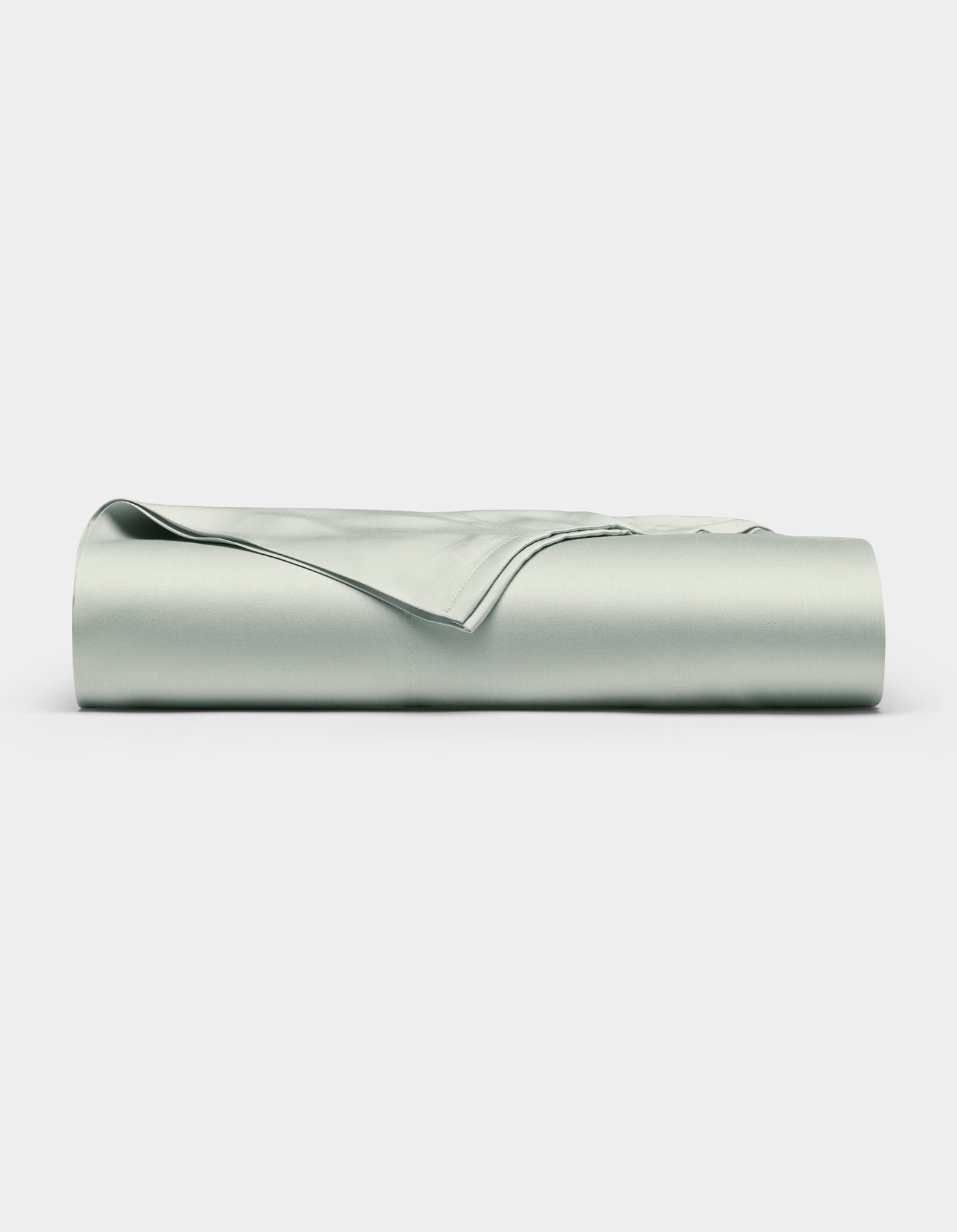 The Cozy Earth Bamboo Flat Sheet, in a light gray shade, is shown neatly folded with smooth edges on a plain white background.