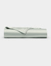The Cozy Earth Bamboo Flat Sheet, in a light gray shade, is shown neatly folded with smooth edges on a plain white background.|Color:Laurel