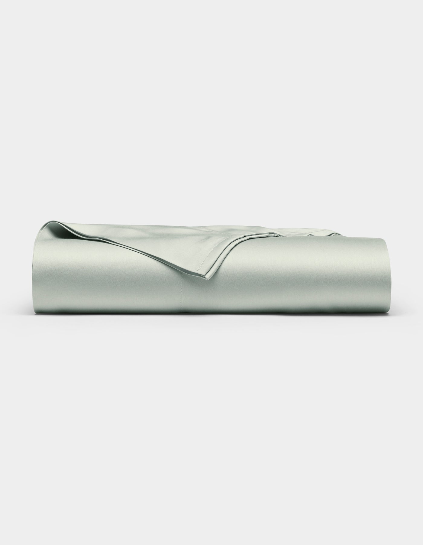 The Cozy Earth Bamboo Flat Sheet, in a light gray shade, is shown neatly folded with smooth edges on a plain white background.