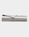 The Cozy Earth Bamboo Flat Sheet, shown in light gray with one corner folded over, is neatly rolled up and displayed against a plain white background.|Color:Light Grey