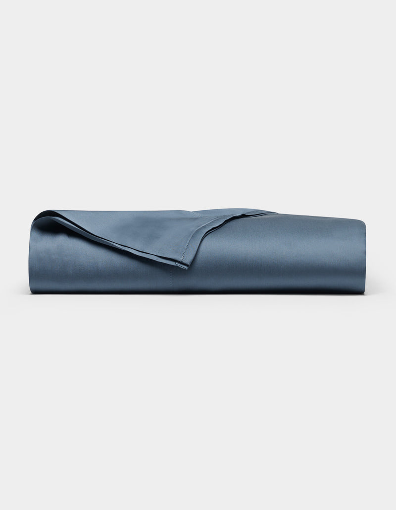 A neatly folded Cozy Earth Bamboo Flat Sheet is displayed against a plain white background.