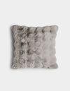 The Bubble Cuddle Pillow by Cozy Earth is a square, light gray faux fur pillow with a soft, fluffy texture, displayed against a plain white background.|Color:Light Grey |Size:20" x 20"