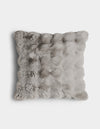 The Bubble Cuddle Pillow by Cozy Earth is a square, light gray faux fur cushion with a fluffy, textured surface, shown from above on a plain white background.|Color:Light Grey |Size:24" x 24"