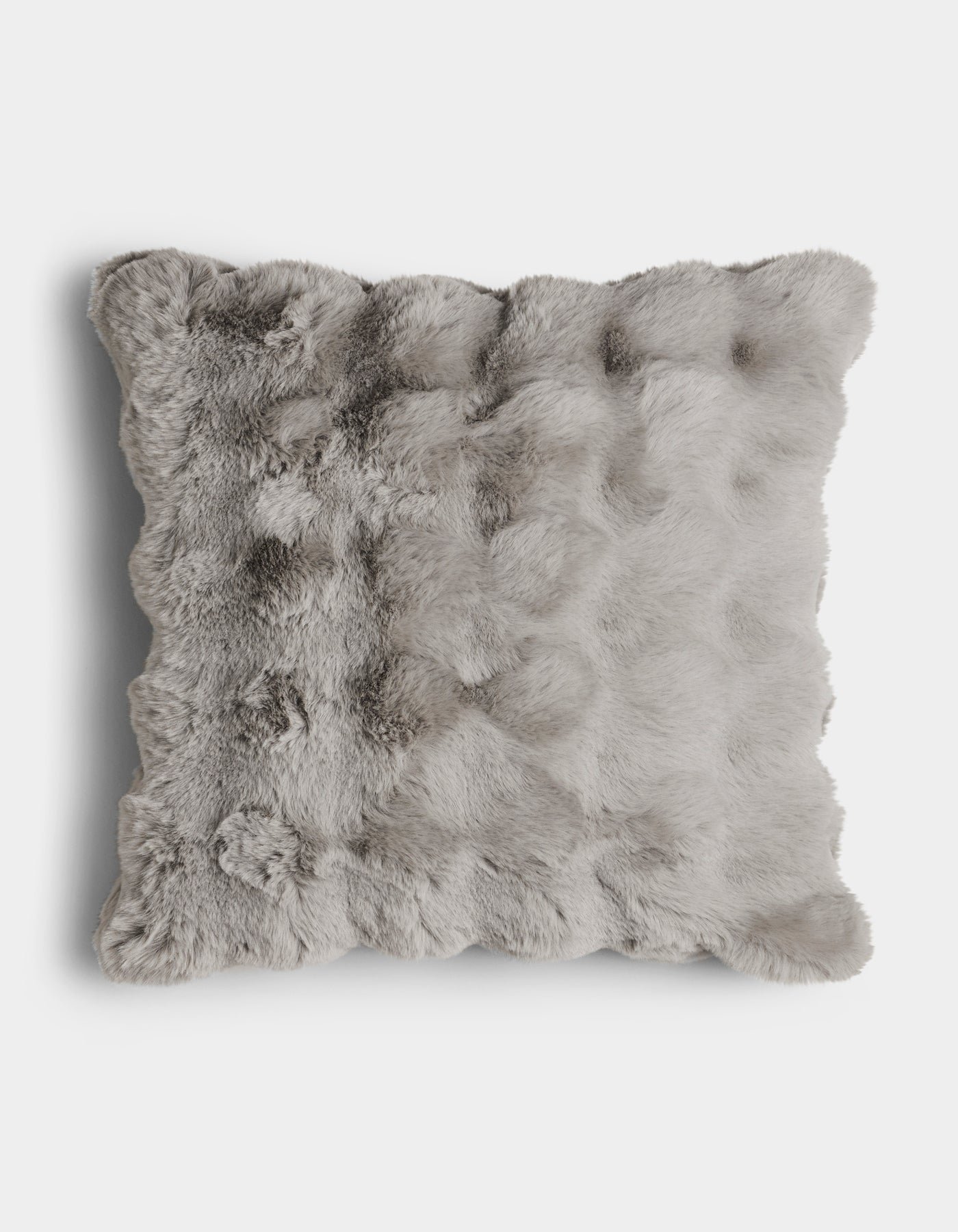 The Bubble Cuddle Pillow by Cozy Earth is a square, light gray faux fur cushion with a fluffy, textured surface, shown from above on a plain white background.|Color:Light Grey