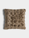 The Bubble Cuddle Pillow by Cozy Earth is a square, brown faux fur pillow with a textured, tufted surface, shown against a white background.|Color:Walnut |Size:24" x 24"