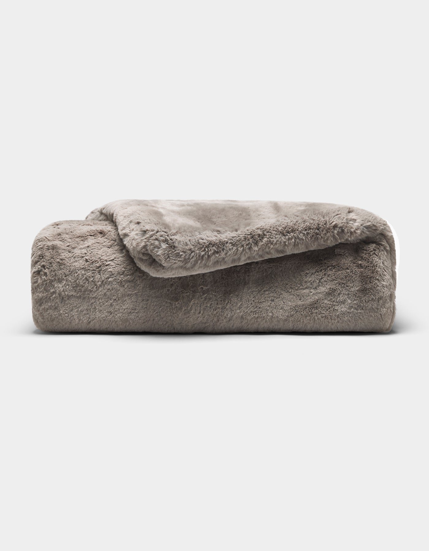 The Cozy Earth Cuddle Blanket, a soft gray faux fur throw, is neatly folded against a plain white background.