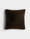 The Cozy Earth Cuddle Pillow is a square, dark brown plush pillow with a soft, fuzzy texture, displayed against a plain white background.|Color:Espresso |Size:24" x 24"