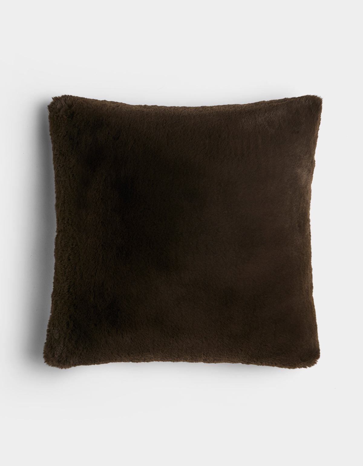 The Cozy Earth Cuddle Pillow is a square, dark brown plush pillow with a soft, fuzzy texture, displayed against a plain white background.