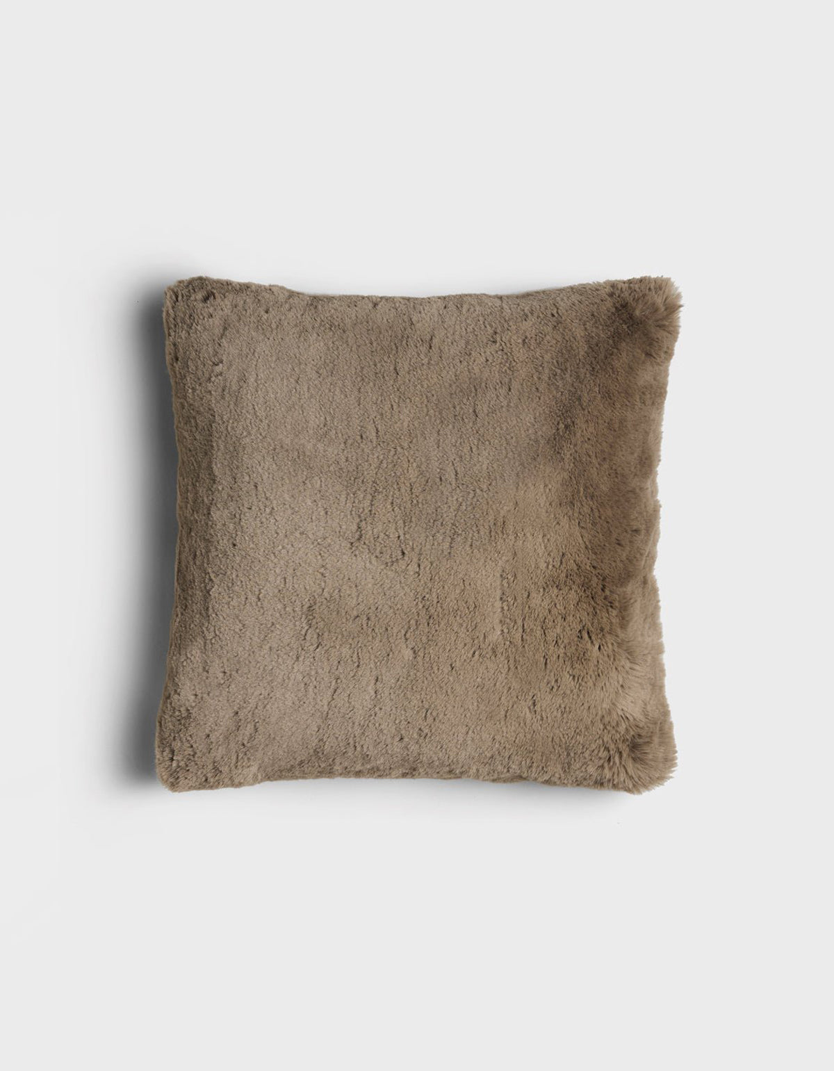 The Cuddle Pillow by Cozy Earth is a square, brown faux fur pillow with a soft, fluffy texture, displayed on a plain white background.