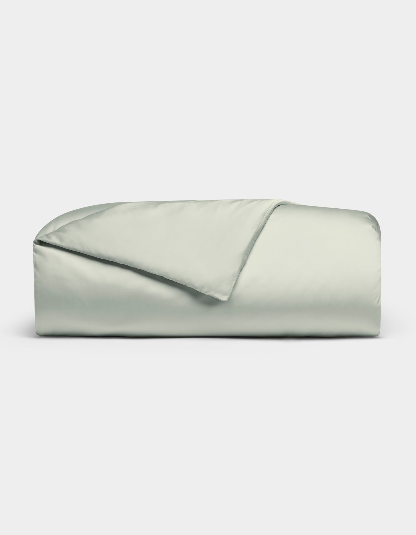 A neatly folded Bamboo Duvet Cover by Cozy Earth in light gray or pale green, with one corner flipped to reveal the interior, set against a plain white background.