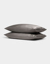 Two Cozy Earth Bamboo Pillowcases in gray are stacked together against a plain light background.|Color:Charcoal