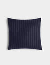 The Florence Pillow by Cozy Earth is a rectangular navy blue pillow with vertical white pinstripes, shown on a plain white background.|Color:Navy