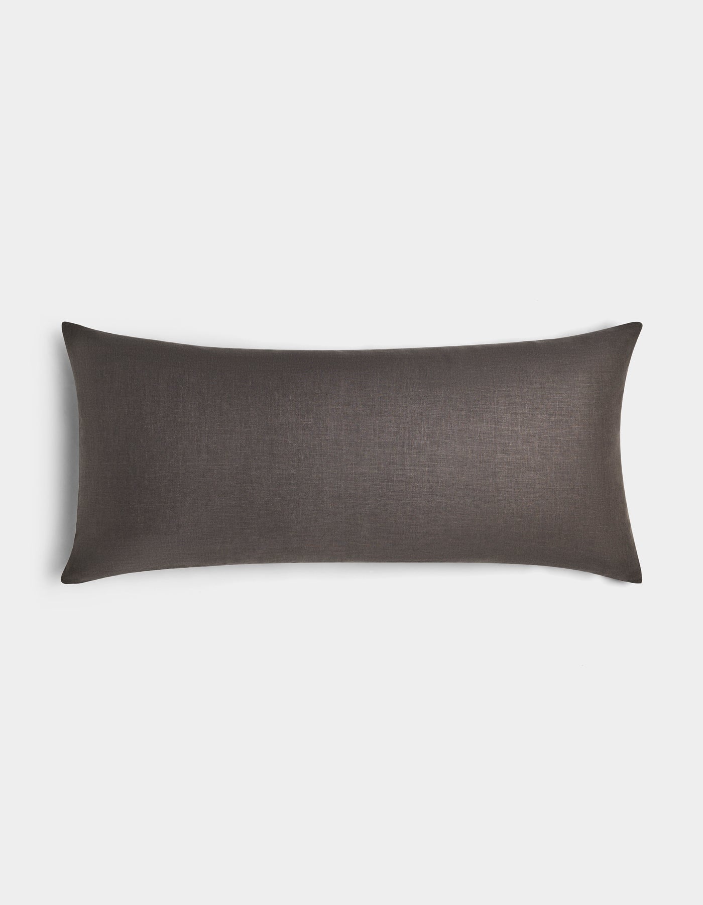 The Cozy Earth Linen Throw Pillow is a long, rectangular pillow with a dark brown, smooth linen cover, displayed on a plain white background.|Color:Coal|Size:14" x 30"