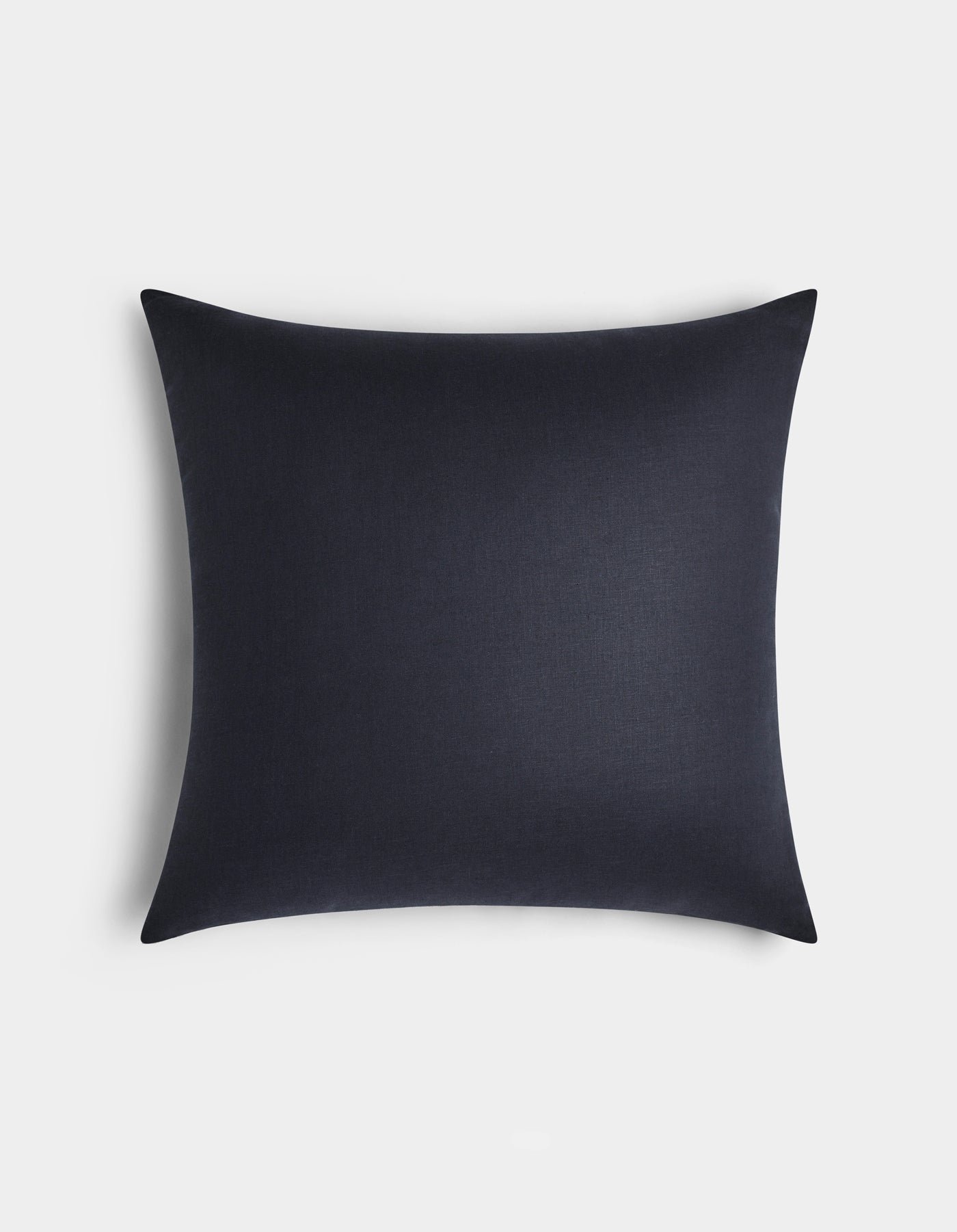 The Cozy Earth Linen Throw Pillow, square and dark navy blue with a smooth texture, is displayed on a plain white background from a top-down view.