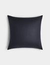 The Cozy Earth Linen Throw Pillow, square and dark navy blue with a smooth texture, is displayed on a plain white background from a top-down view.|Color:Eclipse