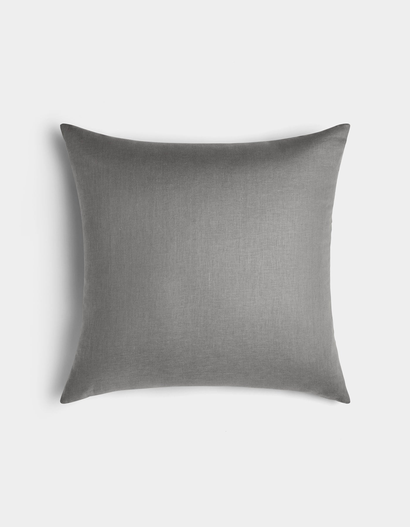The Linen Throw Pillow by Cozy Earth is rectangular and gray, featuring a smooth, solid-colored fabric cover. It is displayed against a plain white background.|Color:Steel