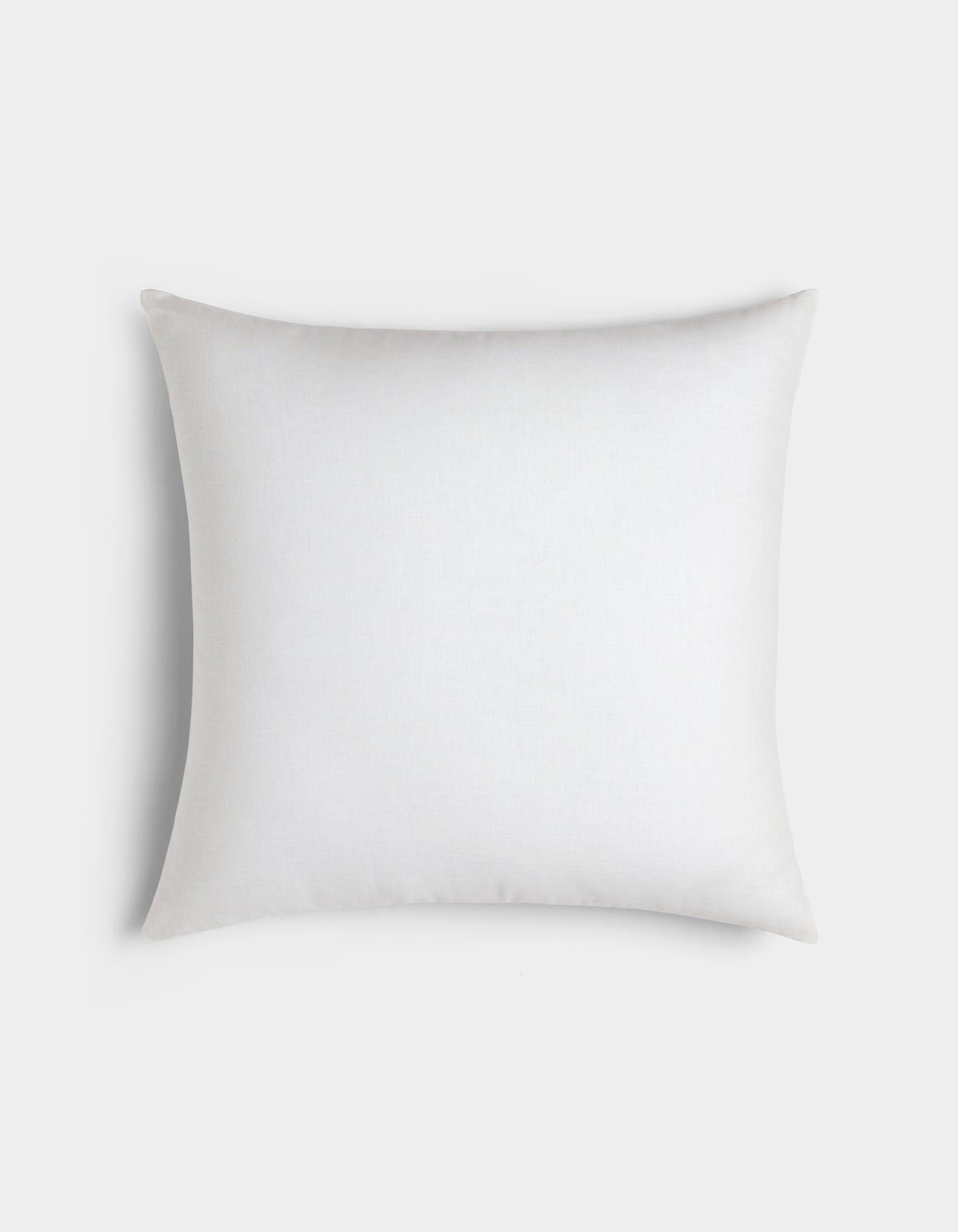The Cozy Earth Linen Throw Pillow features smooth white fabric in a classic square shape, displayed against a light gray background.