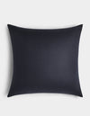 The Cozy Earth Linen Throw Pillow, featuring a smooth black surface and square shape, is placed centrally against a white background.|Color:Eclipse|Size:26" x 26"