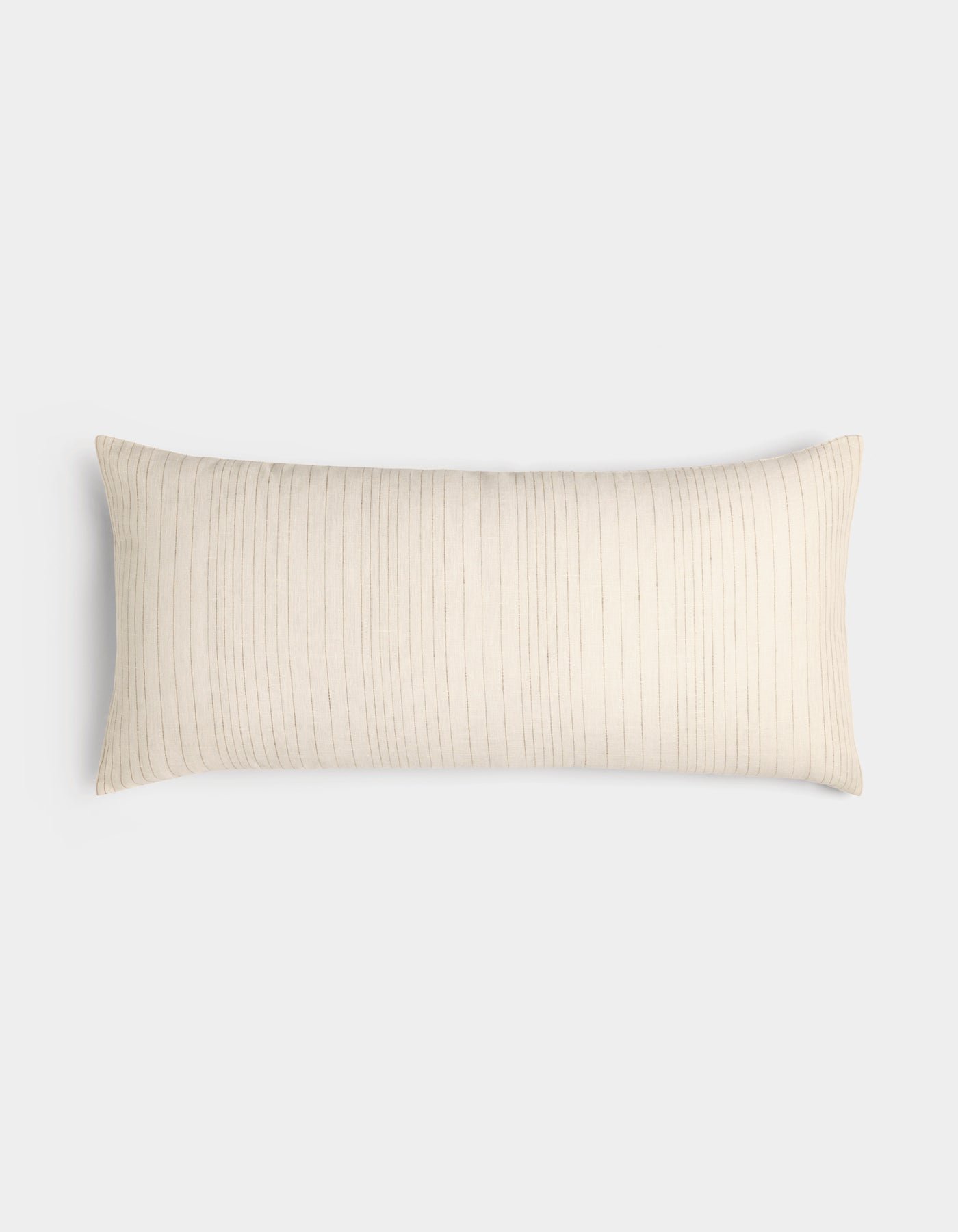 The Cozy Earth Striped Throw Pillow is rectangular and cream-colored with thin, vertical light brown stripes, displayed on a plain white background.
