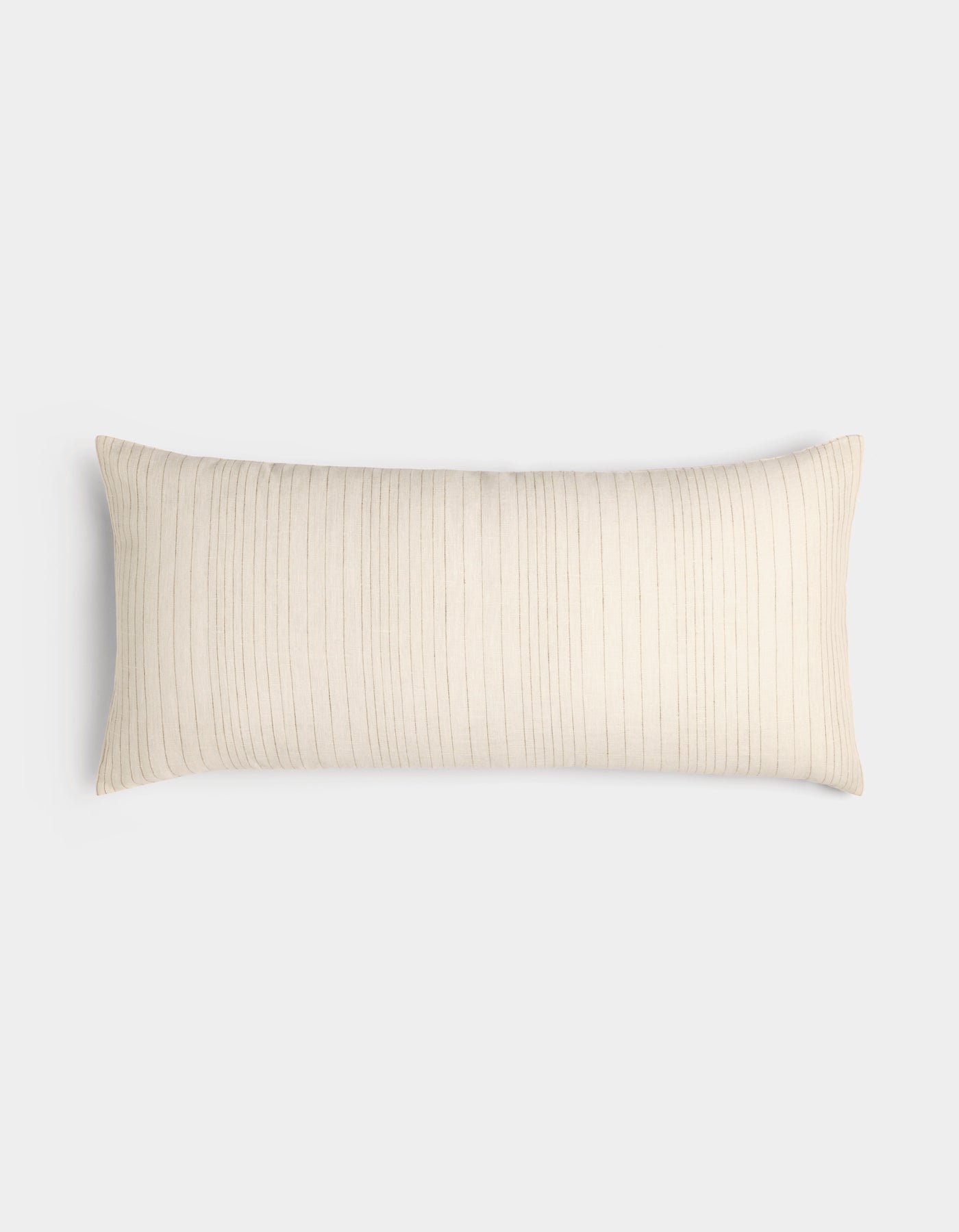 The Cozy Earth Striped Throw Pillow is rectangular and cream-colored with thin, vertical light brown stripes, displayed on a plain white background.