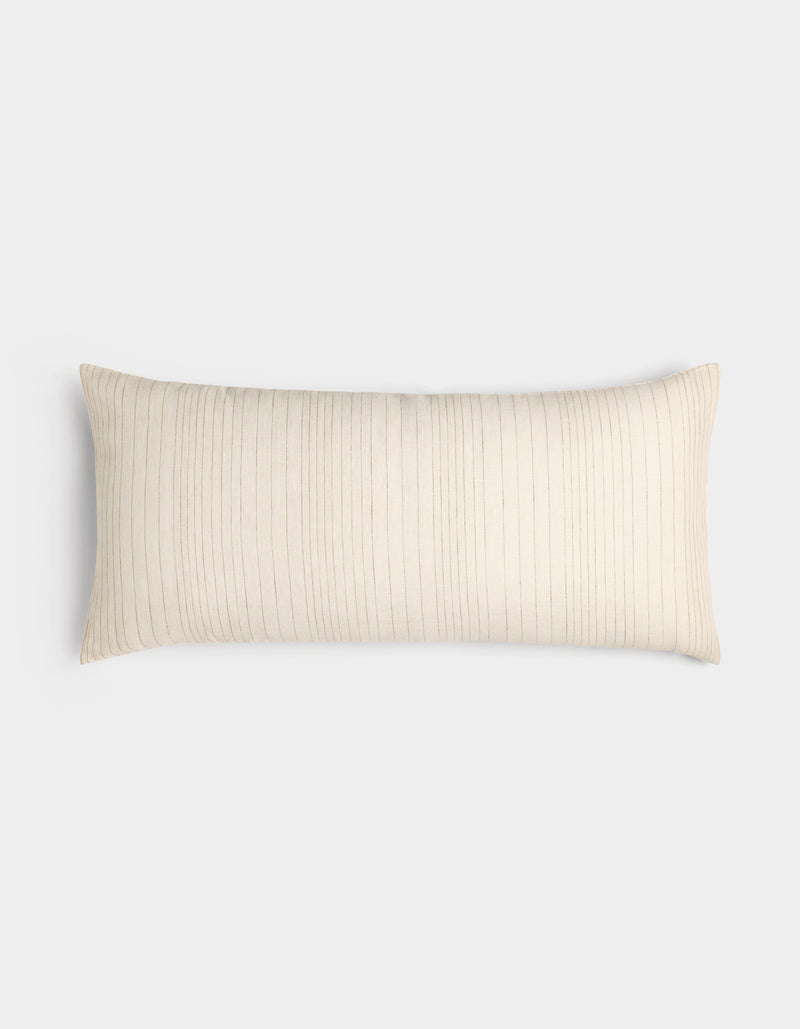 The Cozy Earth Striped Throw Pillow is rectangular and cream-colored with thin, vertical light brown stripes, displayed on a plain white background.