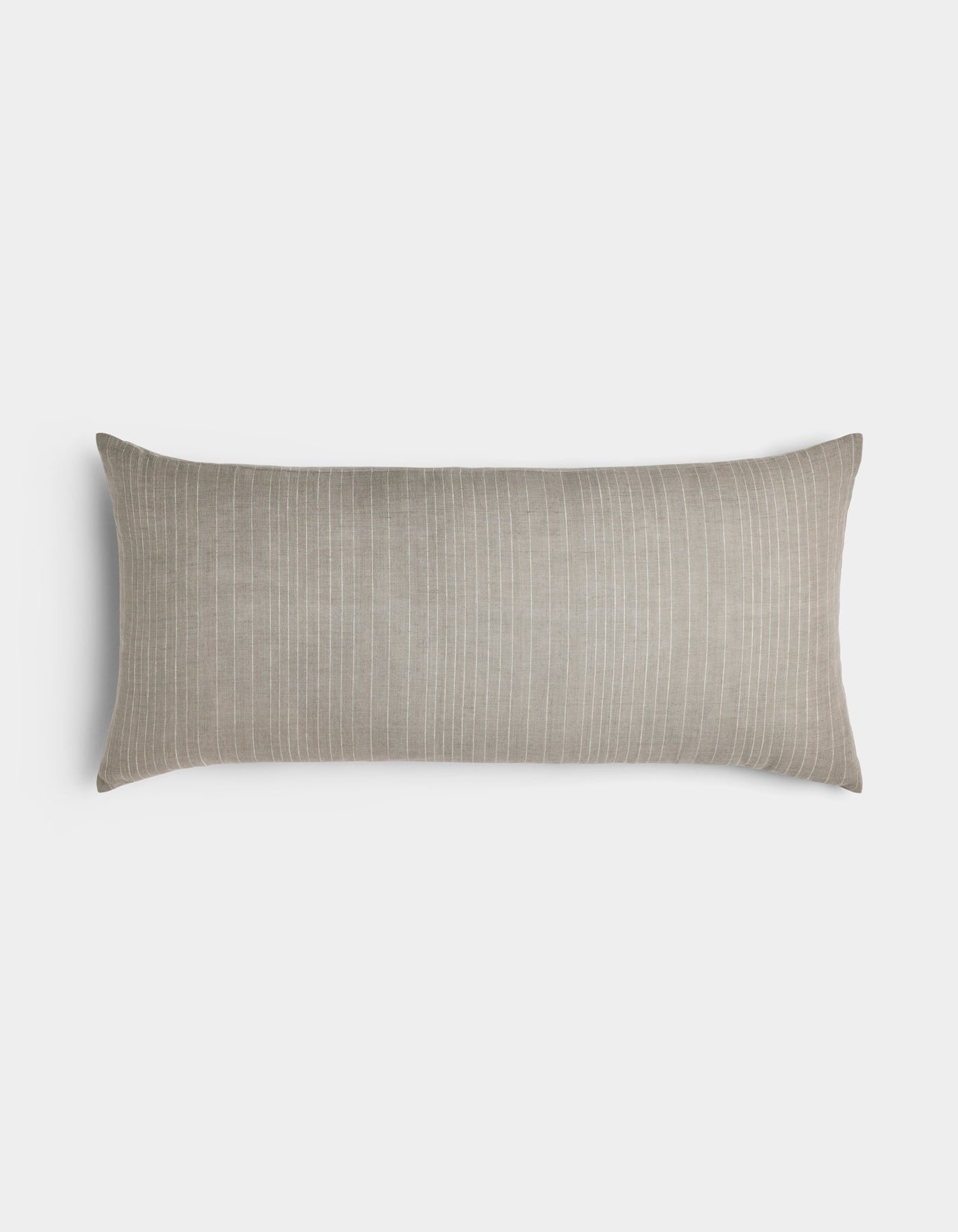 The Cozy Earth Striped Throw Pillow is a long rectangular beige accent with subtle white vertical pinstripes, shown on a plain light gray background.