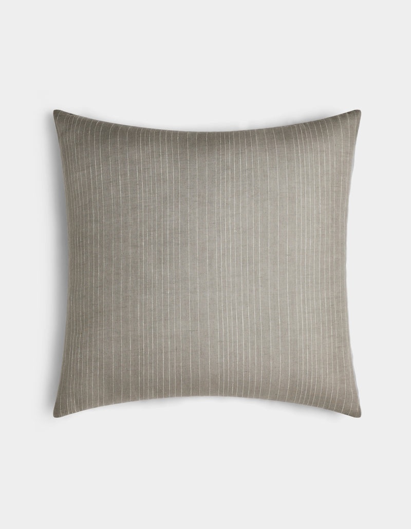 The Cozy Earth Striped Throw Pillow features a light gray square cover with thin white vertical pinstripes, shown against a plain white background.
