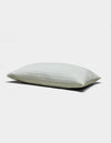 The Baja Matelasse Sham by Cozy Earth is a light-colored, rectangular pillow sham with a soft, textured surface. Displayed against a white background, it looks plush and comfortable.|Color:Bone/Laurel