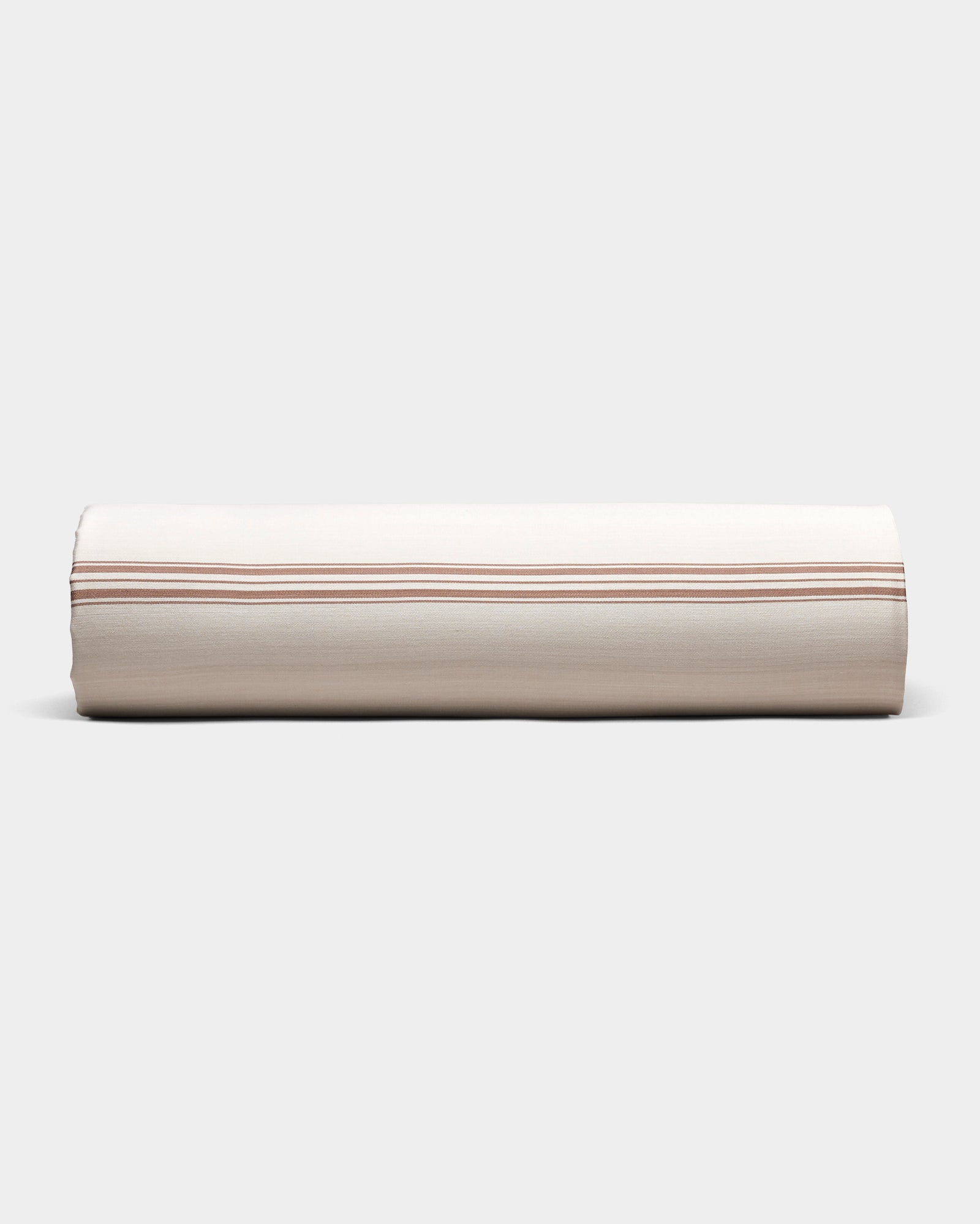The Cozy Earth Bamboo Sheet Set is shown neatly rolled in beige fabric with thin, evenly spaced brown stripes, on a plain light gray background.