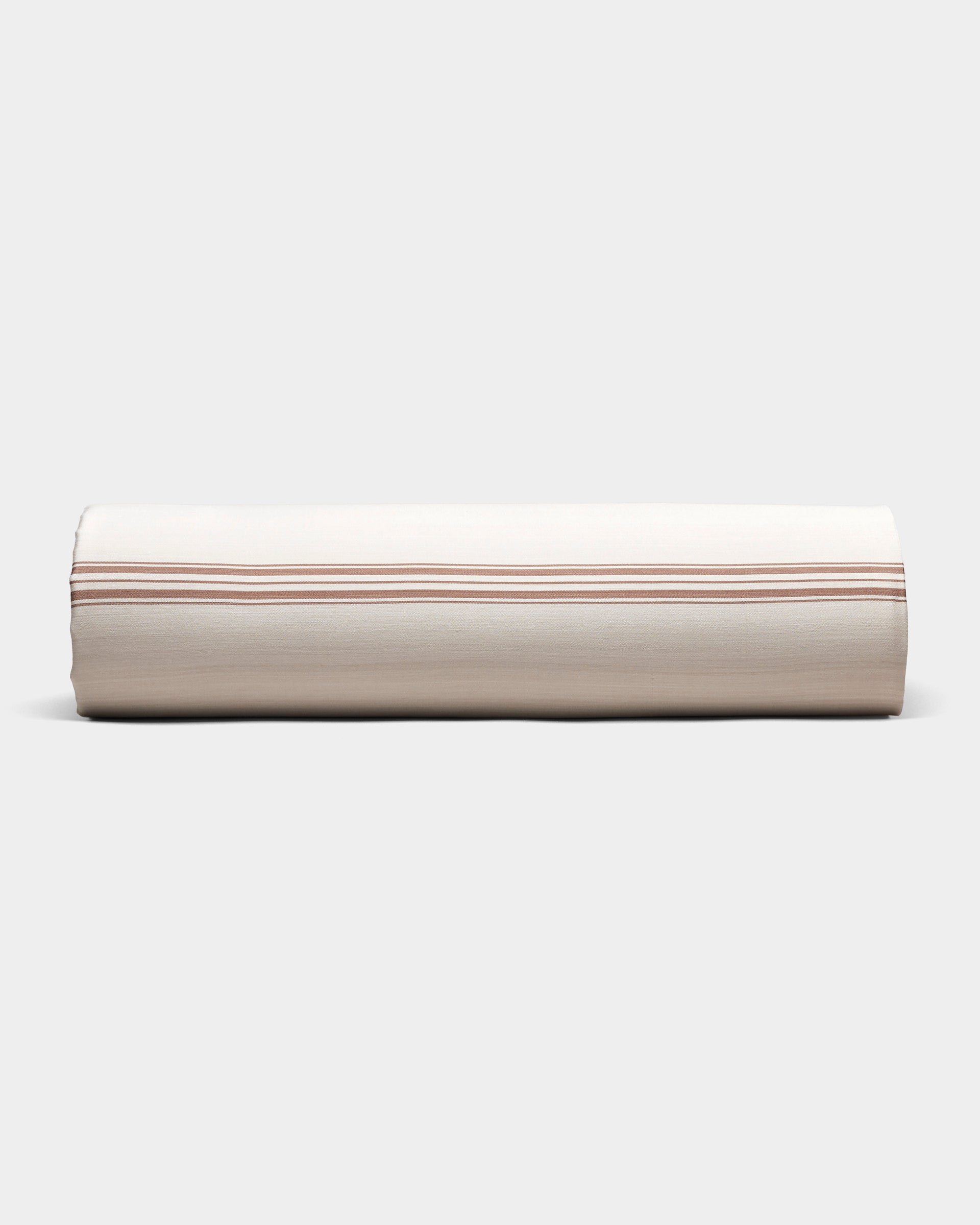 The Cozy Earth Bamboo Sheet Set is shown neatly rolled in beige fabric with thin, evenly spaced brown stripes, on a plain light gray background.
