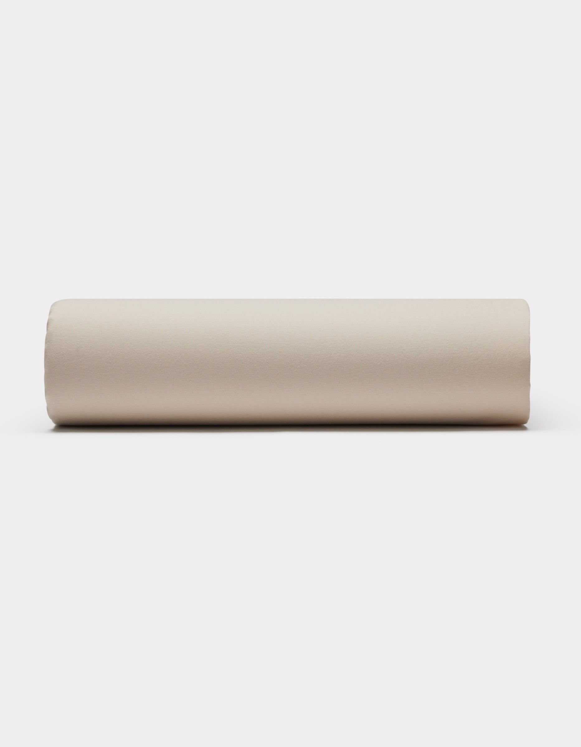 A Soft-Wash Cotton Sheet Set by Cozy Earth is displayed on a plain white background, viewed directly from the side.