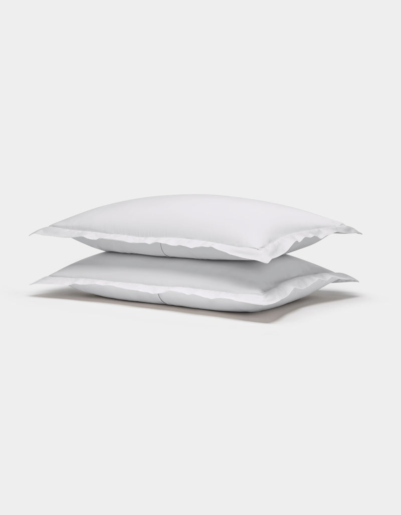 Two Cozy Earth Soft-Wash Cotton Shams are stacked neatly on top of each other against a plain white background.