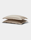 Two Soft-Wash Cotton Quilted Shams by Cozy Earth, in beige, stacked atop each other against a plain white background.|Color:Driftwood