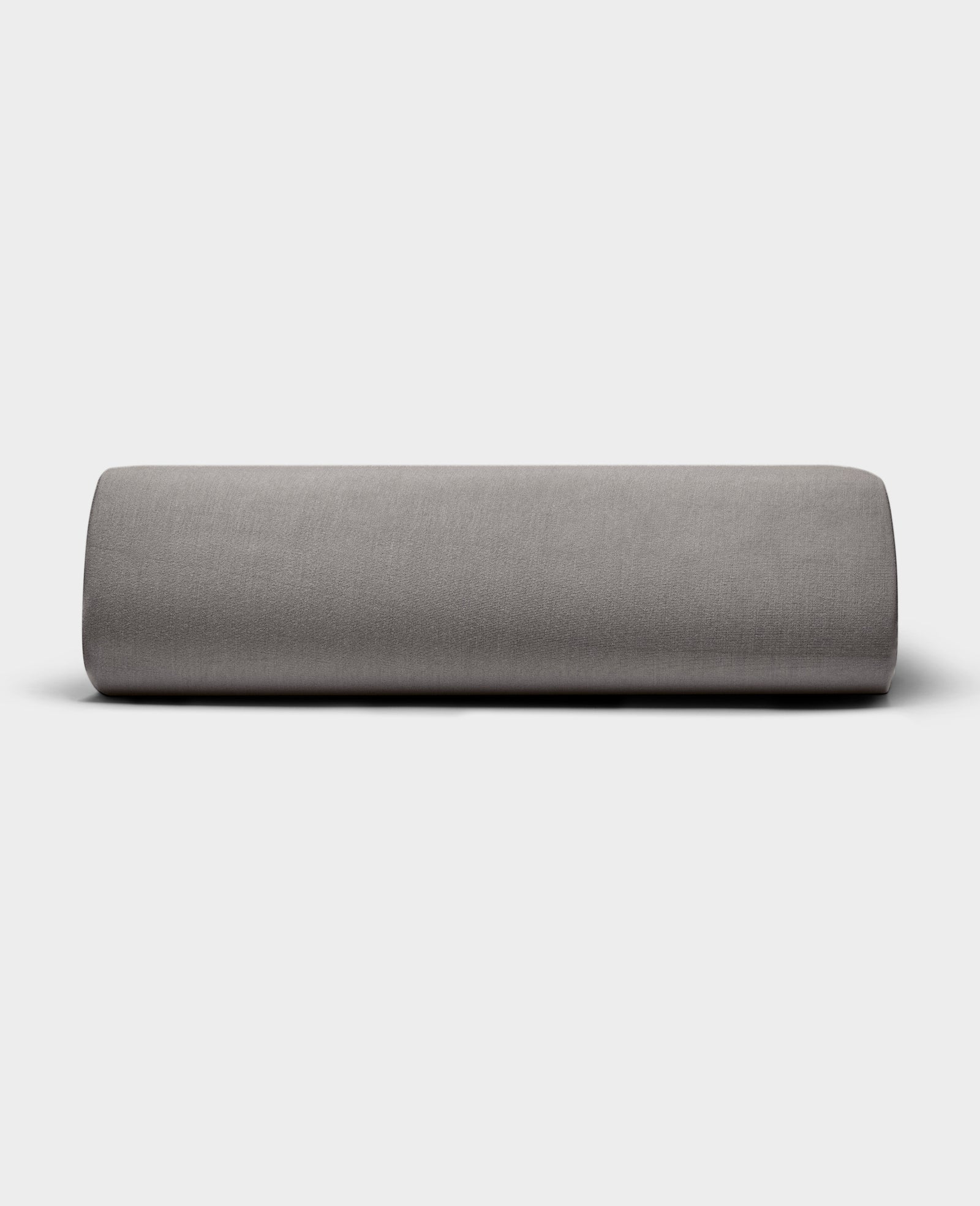 The Bamboo Jersey Fitted Sheet by Cozy Earth is displayed with its smooth gray fabric against a plain white background.
