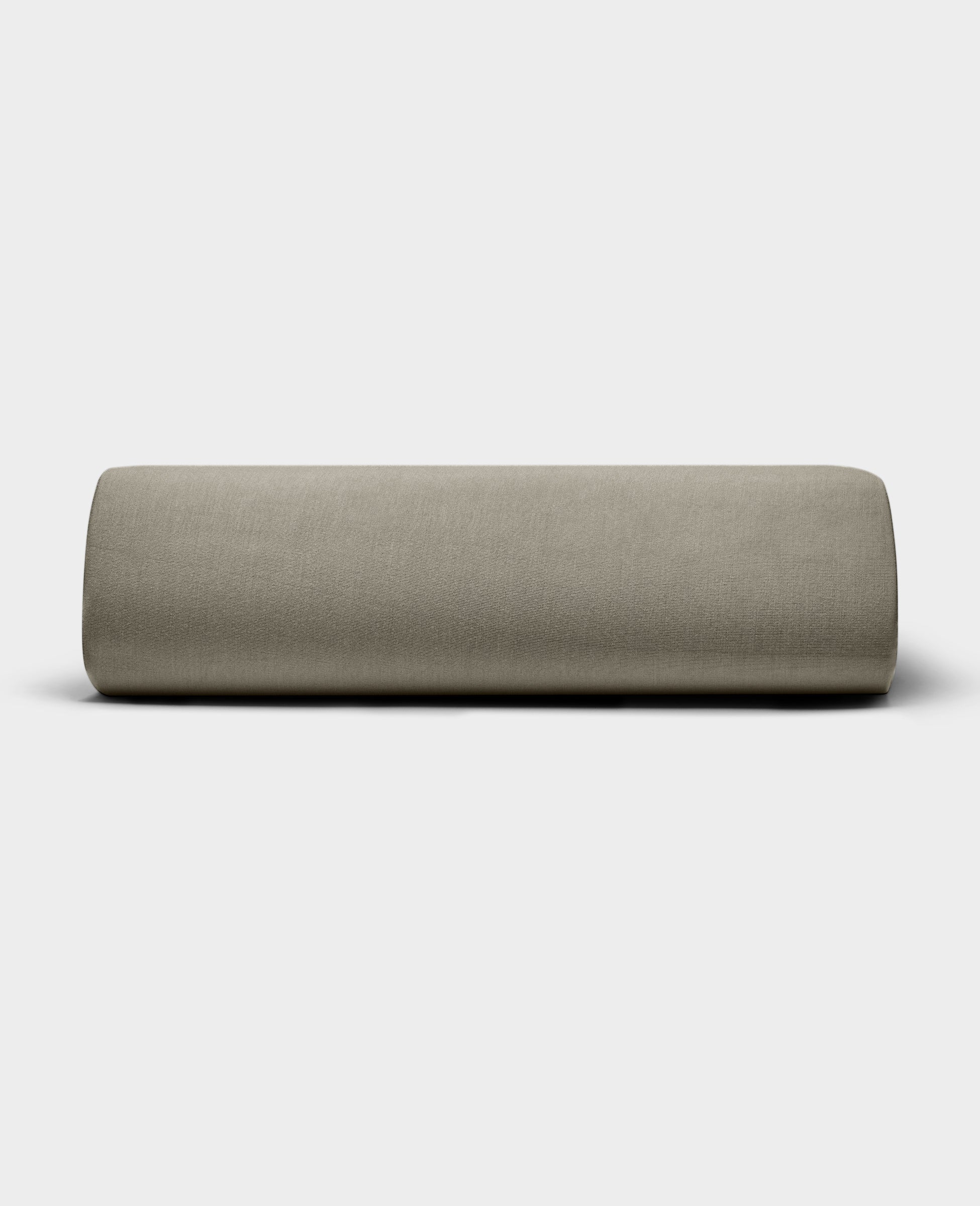 The Bamboo Jersey Fitted Sheet by Cozy Earth, shown in light beige with a smooth fabric texture, is displayed against a plain white background.|Color:Stone