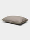 The Bamboo Jersey Quilted Shams by Cozy Earth are rectangular, light gray pillows with a quilted pattern, shown lying flat on a white background.|Color:Stone