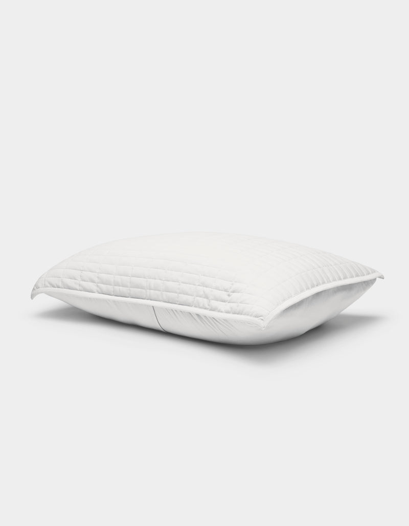 The Cozy Earth Bamboo Jersey Quilted Sham is a white, rectangular pillow cover with a quilted pattern, displayed against a light background. It looks plush with a gentle indentation in the center.