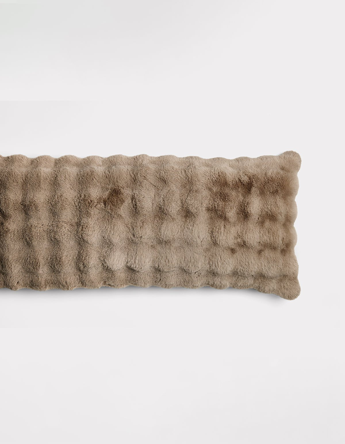 The Bubble Cuddle Pillow by Cozy Earth is a rectangular, light brown pillow with a soft, plush, furry texture, shown against a plain white background.|Color:Walnut |Size:Body