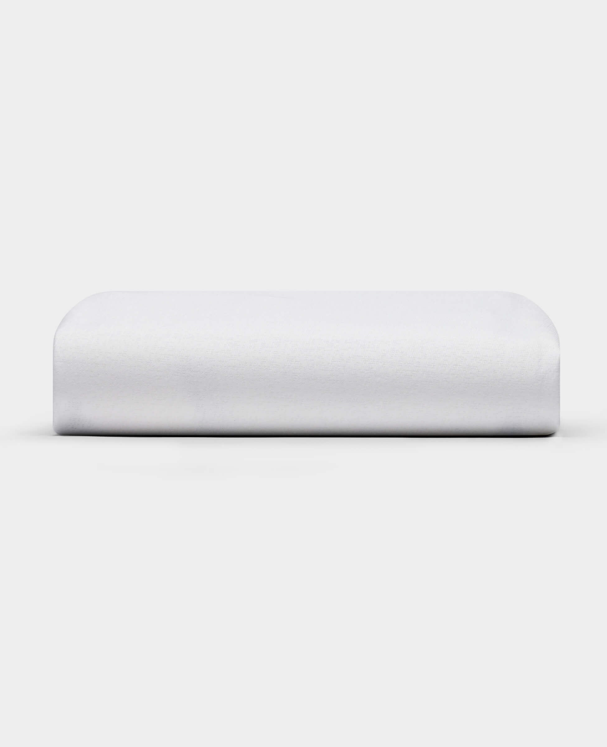 The Cozy Earth Cooling Mattress Protector is shown against a plain white background. It appears firm, rectangular with smooth, rounded edges, and has a crisp white finish.