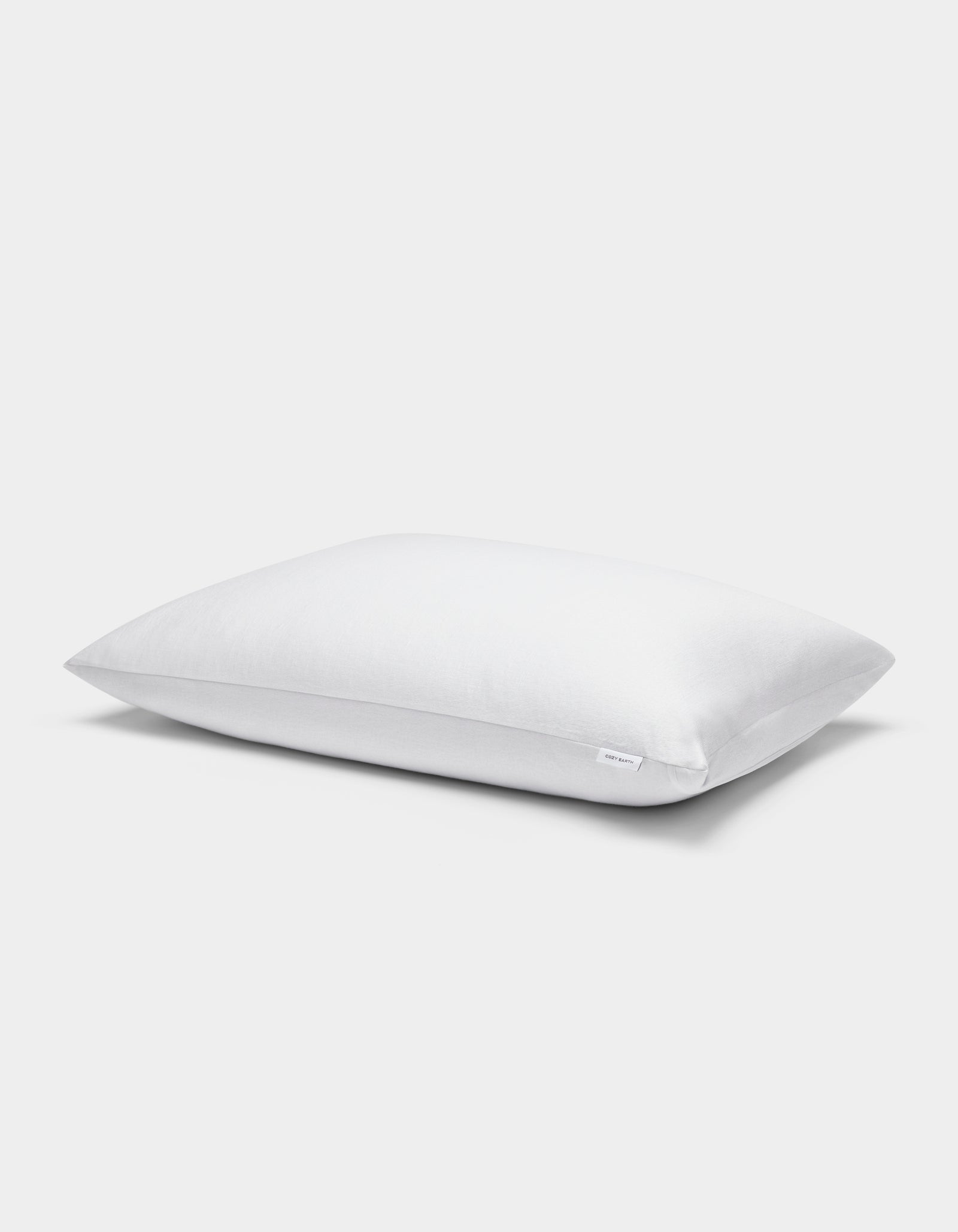 A single Cozy Earth Cooling Pillow Protector in white, rectangular shape with a plain cover, displayed on a white background.