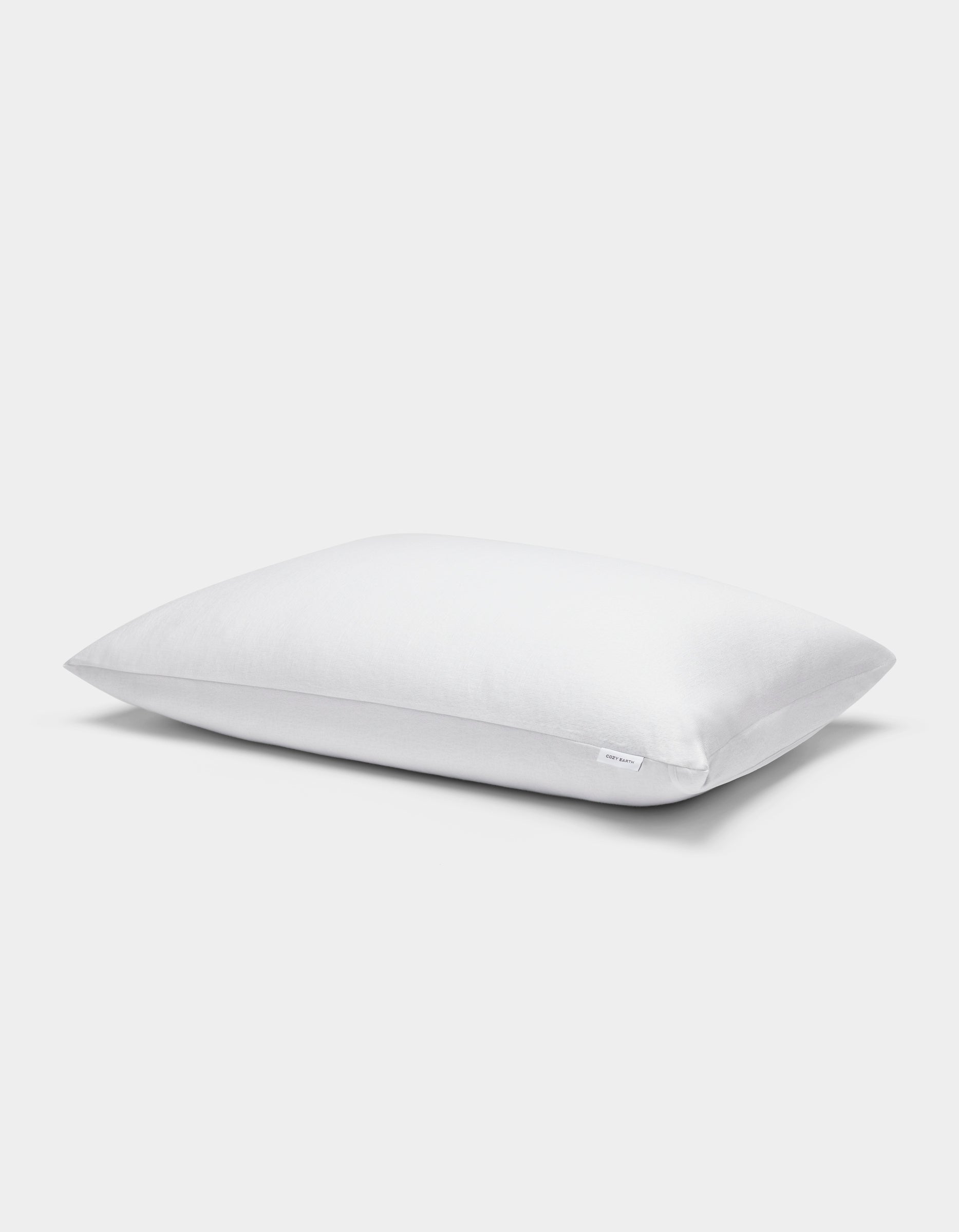A single Cozy Earth Cooling Pillow Protector in white, rectangular shape with a plain cover, displayed on a white background.