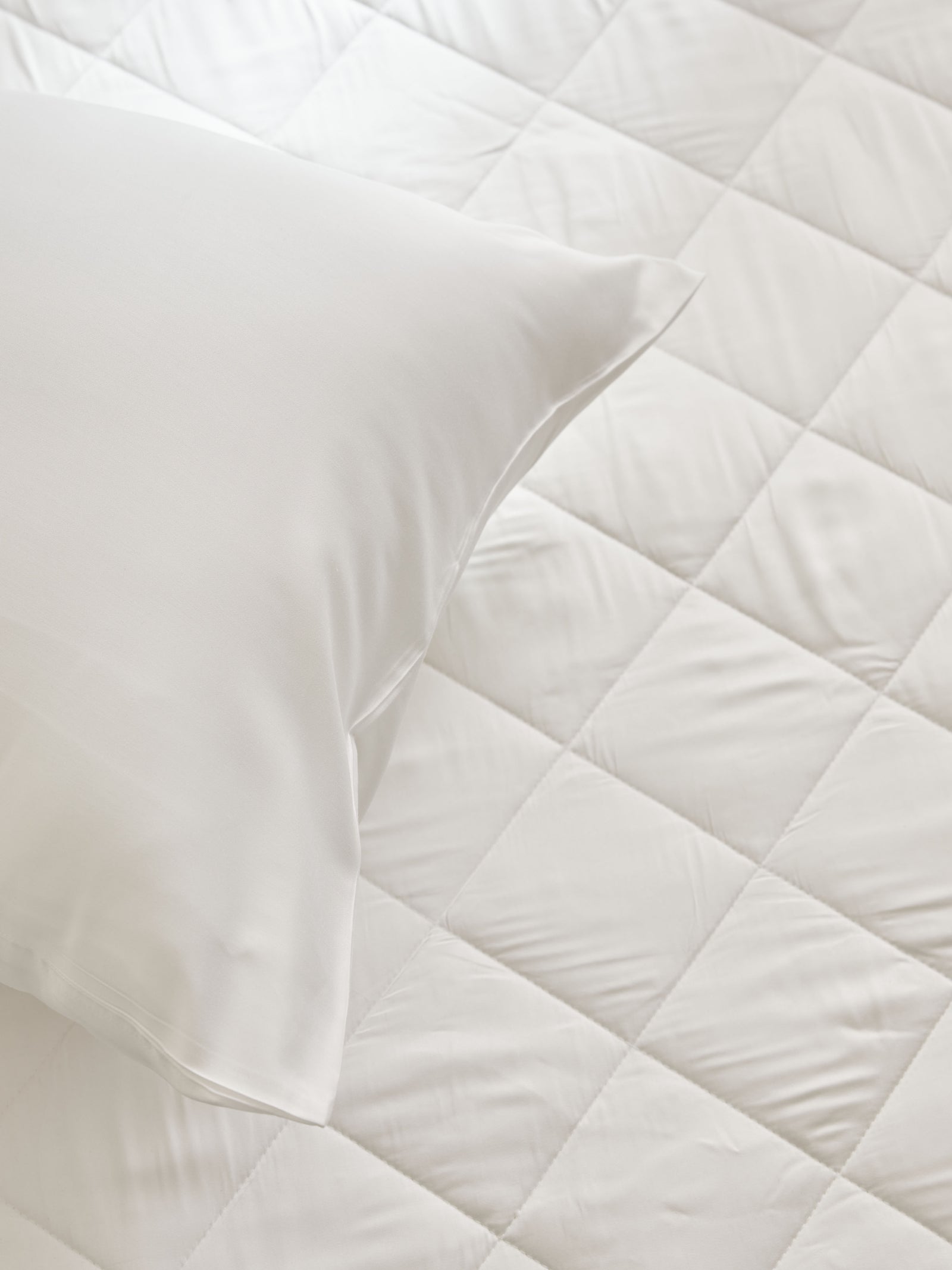 Bamboo Mattress Pad close up with white pillow