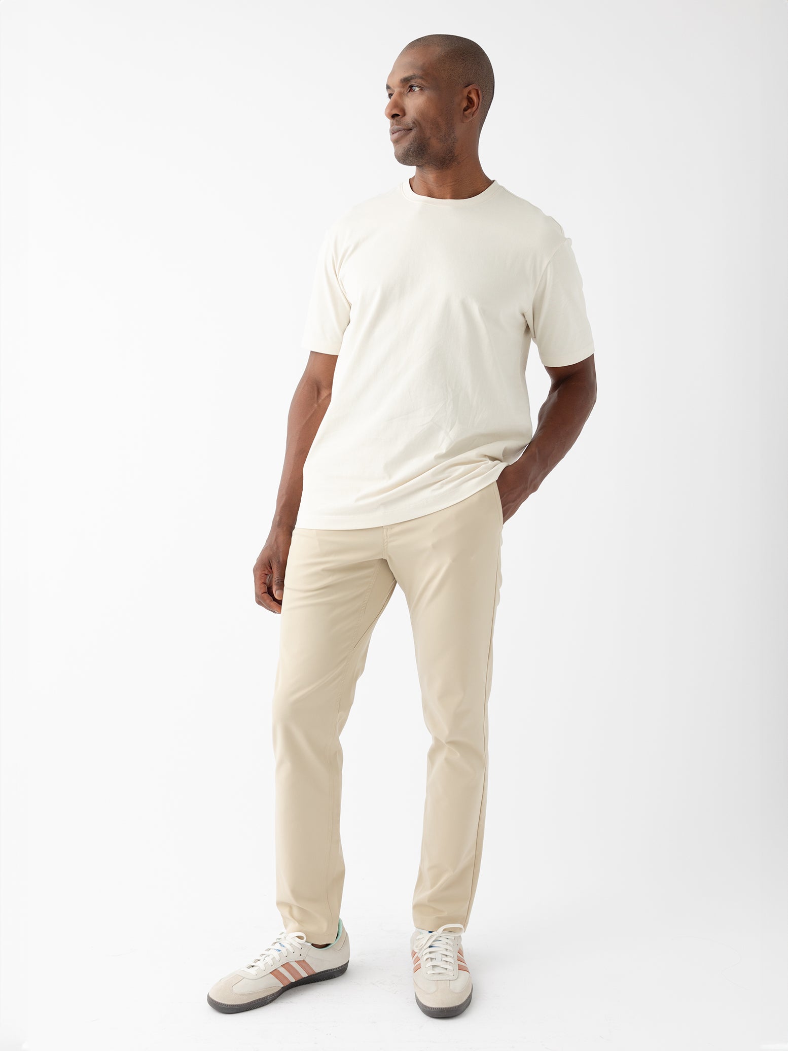 Man wearing alabaster tee and khaki pants with white background |Color:Alabaster