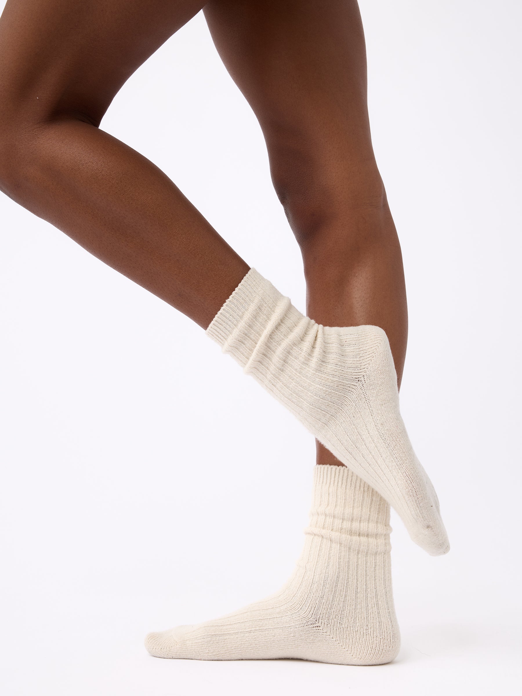 Person wearing Cozy Earth Plush Lounge Calf Sock 1-Pack in Alabaster 