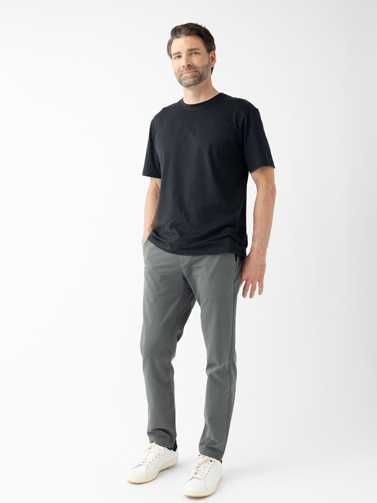 Man wearing black tee and grey pants with white background |Color:Jet Black